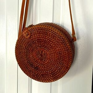 Adorable camel wicker woven circle boho purse with beautiful interior print